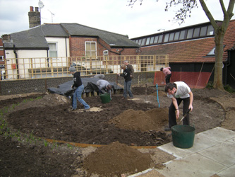 Weeding and spreading soil